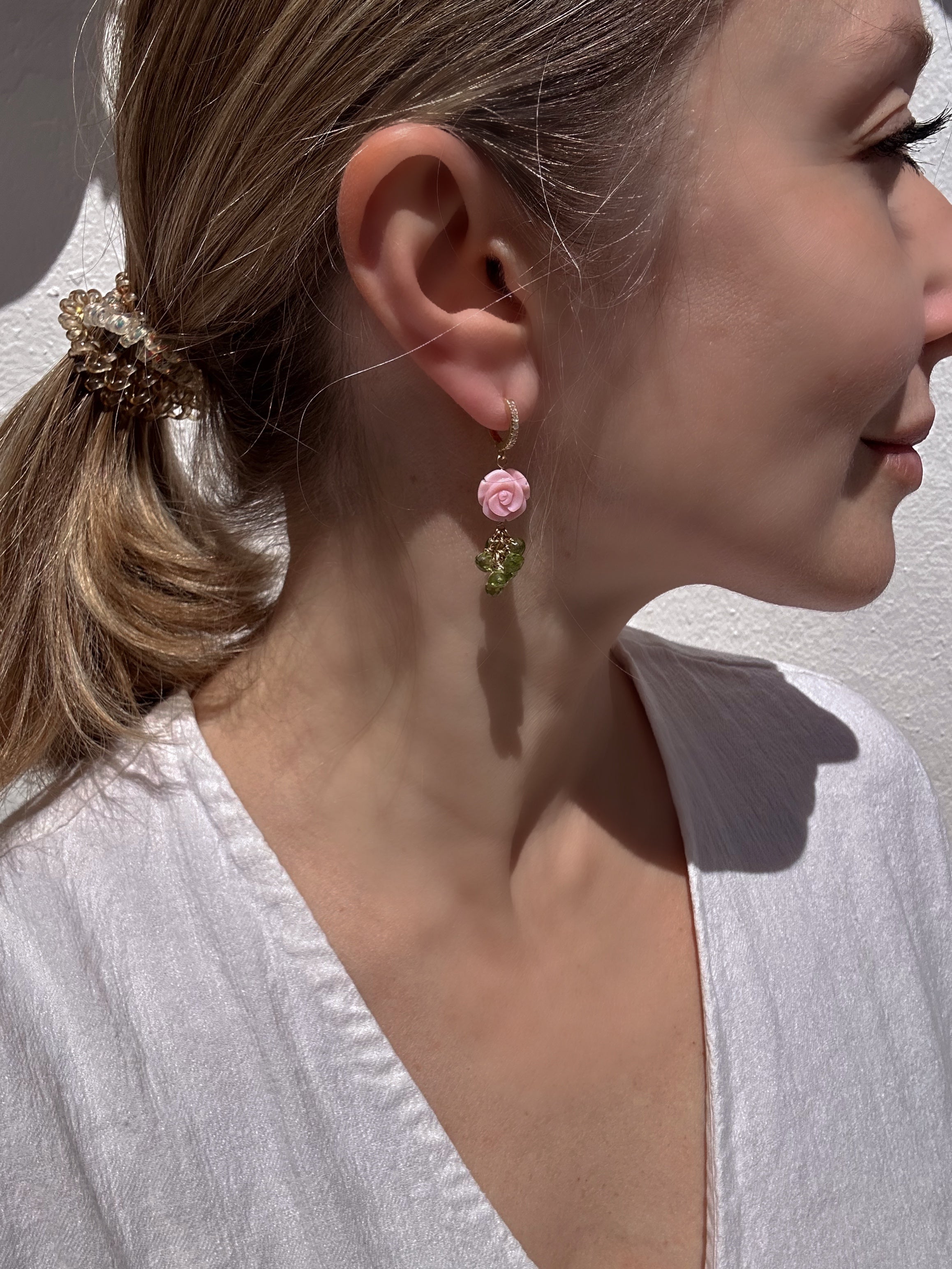 Carved queen conch shell rose and peridot drop earrings