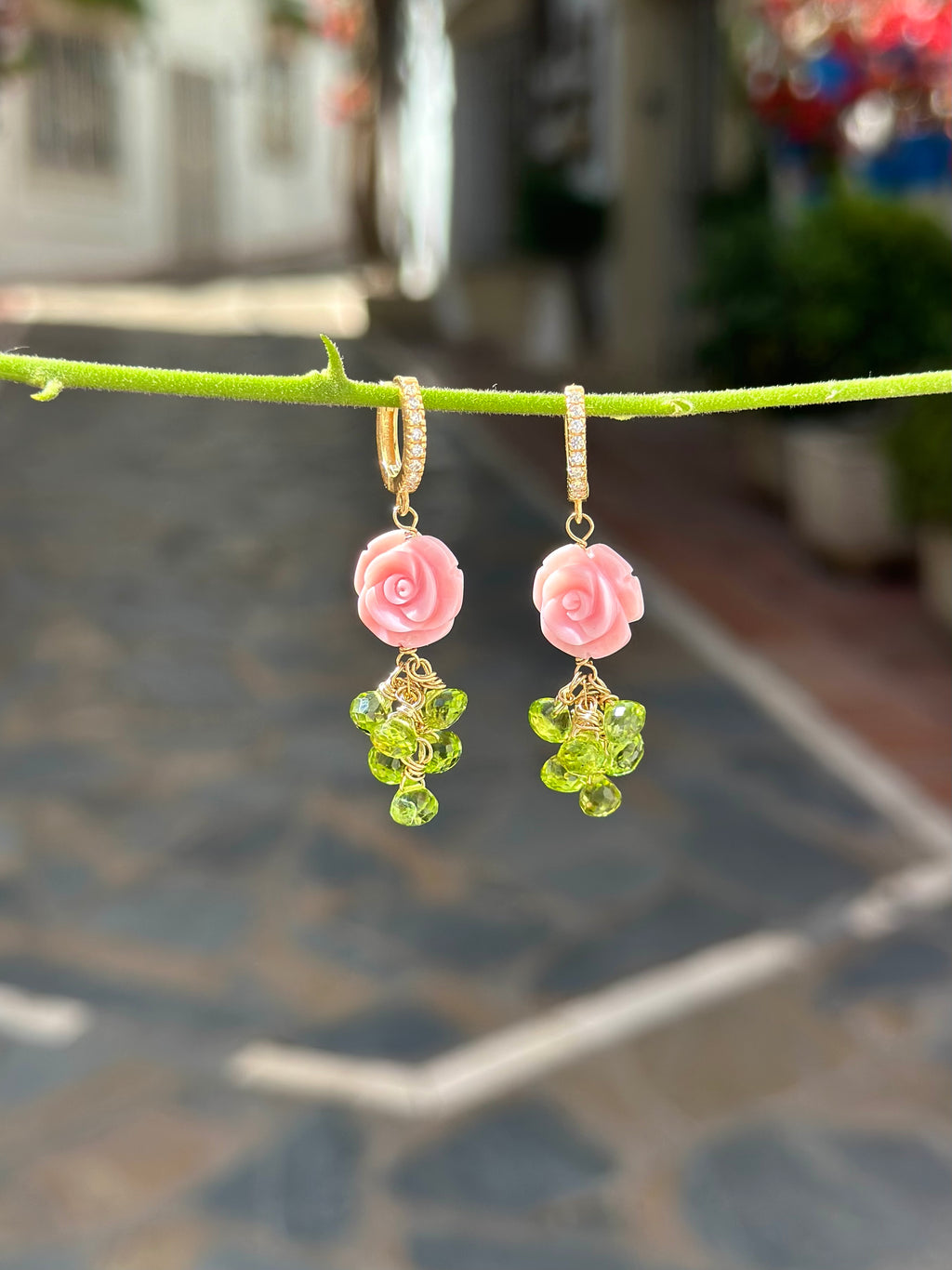 Carved queen conch shell rose and peridot drop earrings