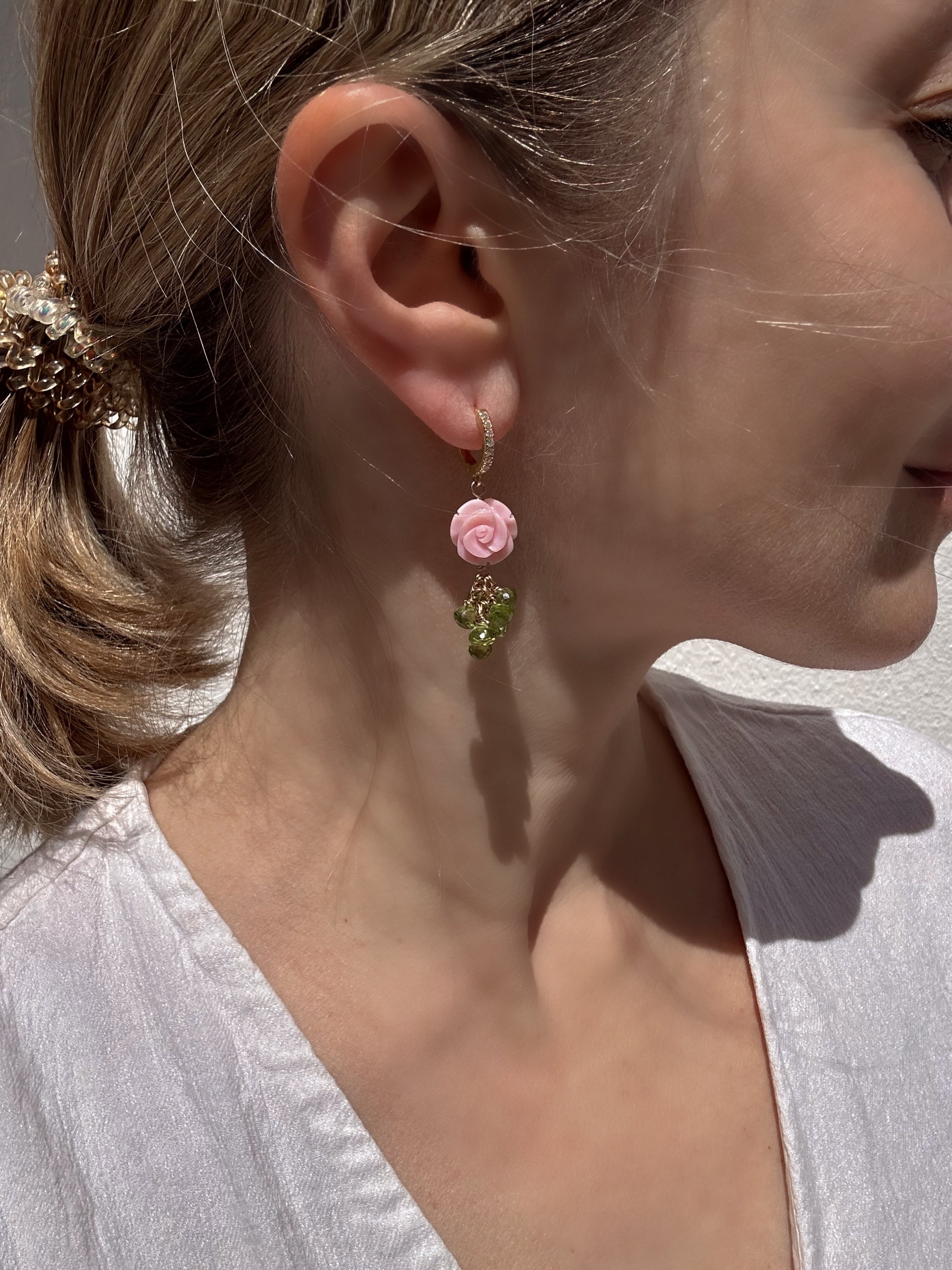 Carved queen conch shell rose and peridot drop earrings