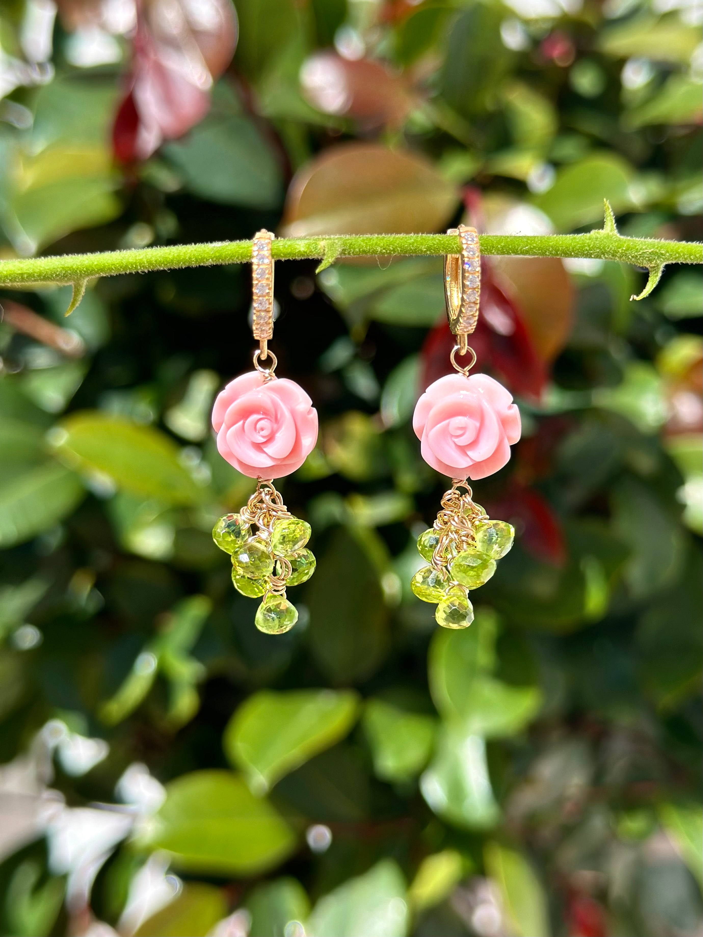 Carved queen conch shell rose and peridot drop earrings