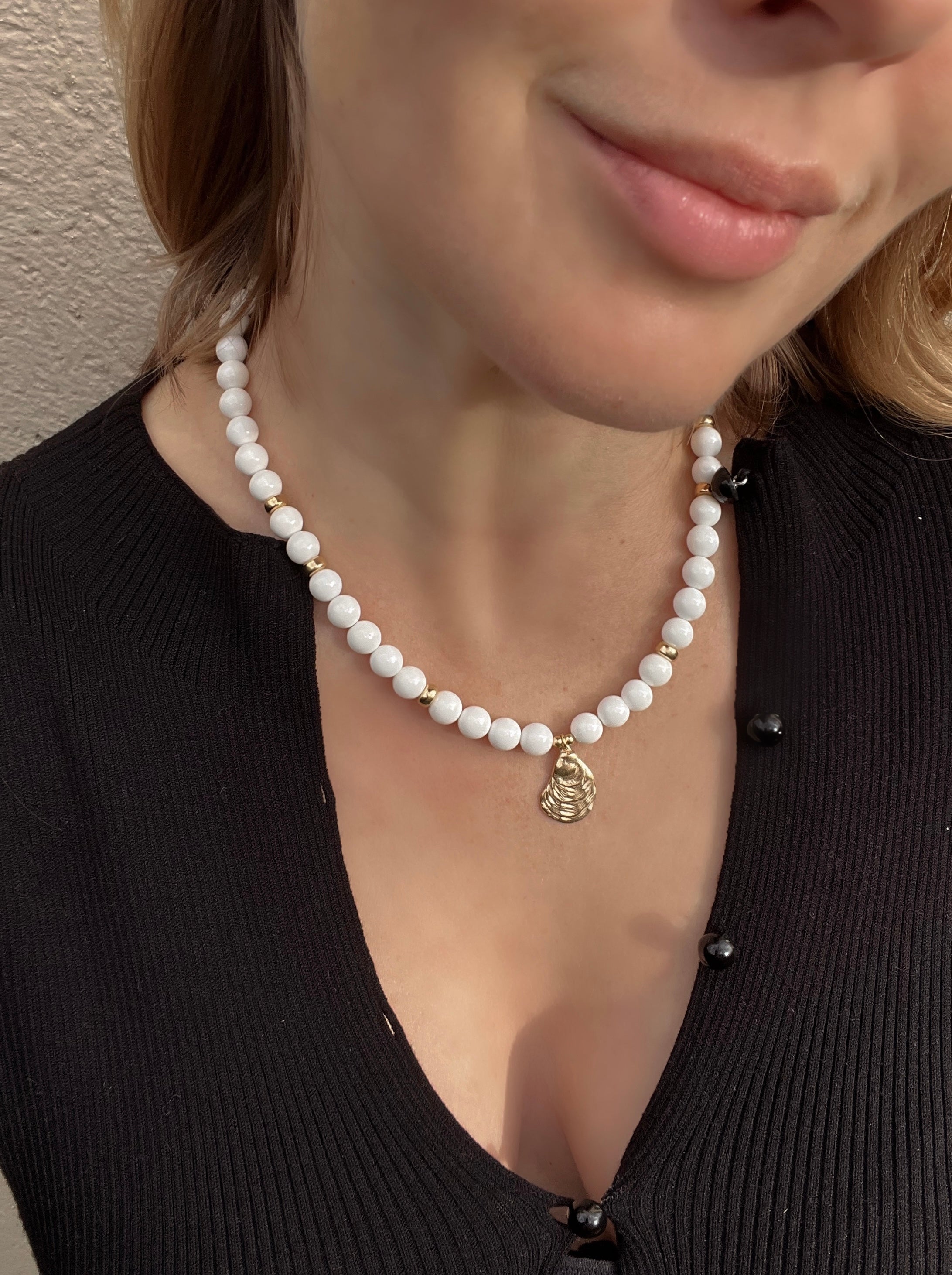 White bead necklace with golden sea shell charm