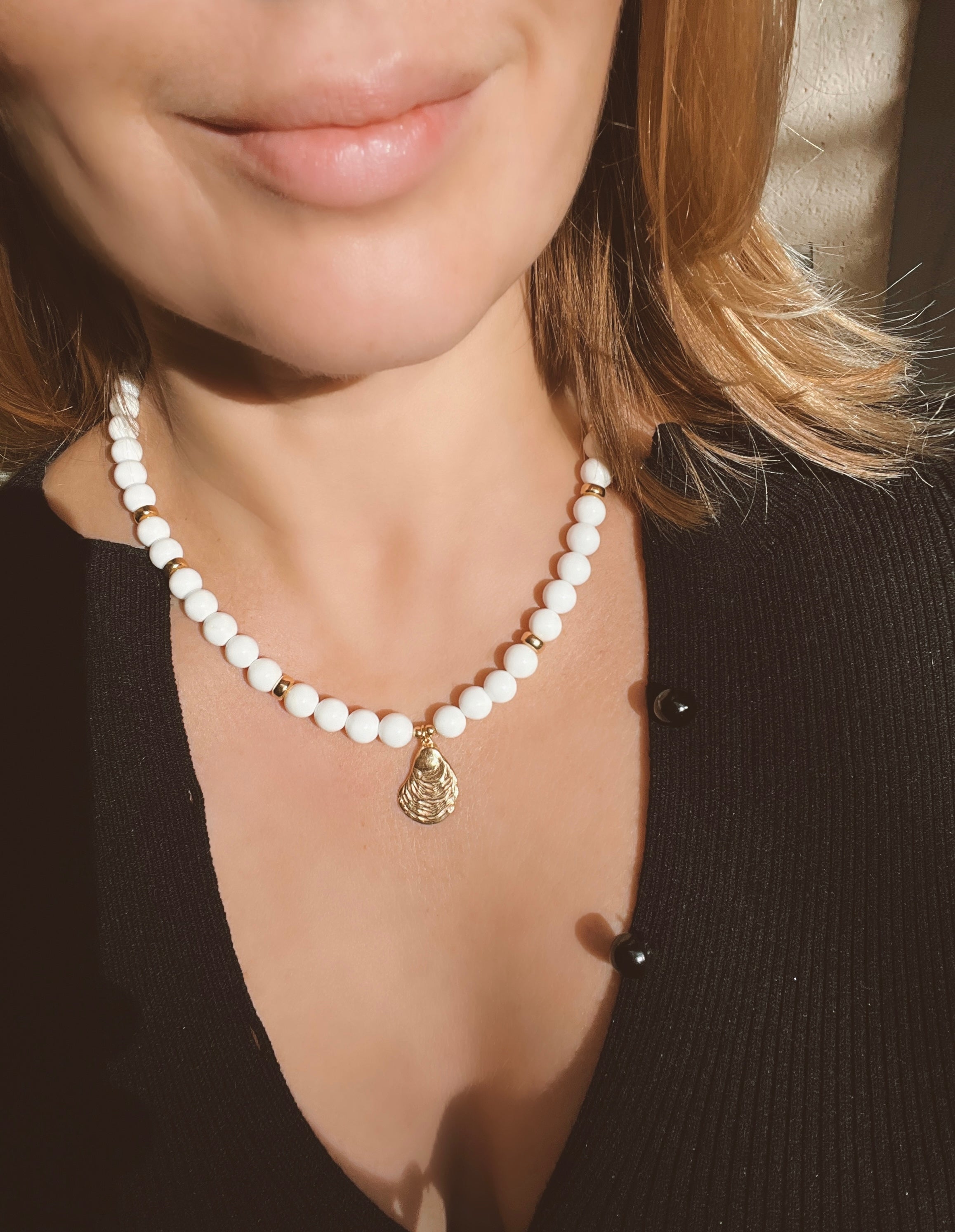 White bead necklace with golden sea shell charm