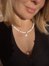 White bead necklace with golden sea shell charm