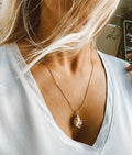 Shell with pearl necklace