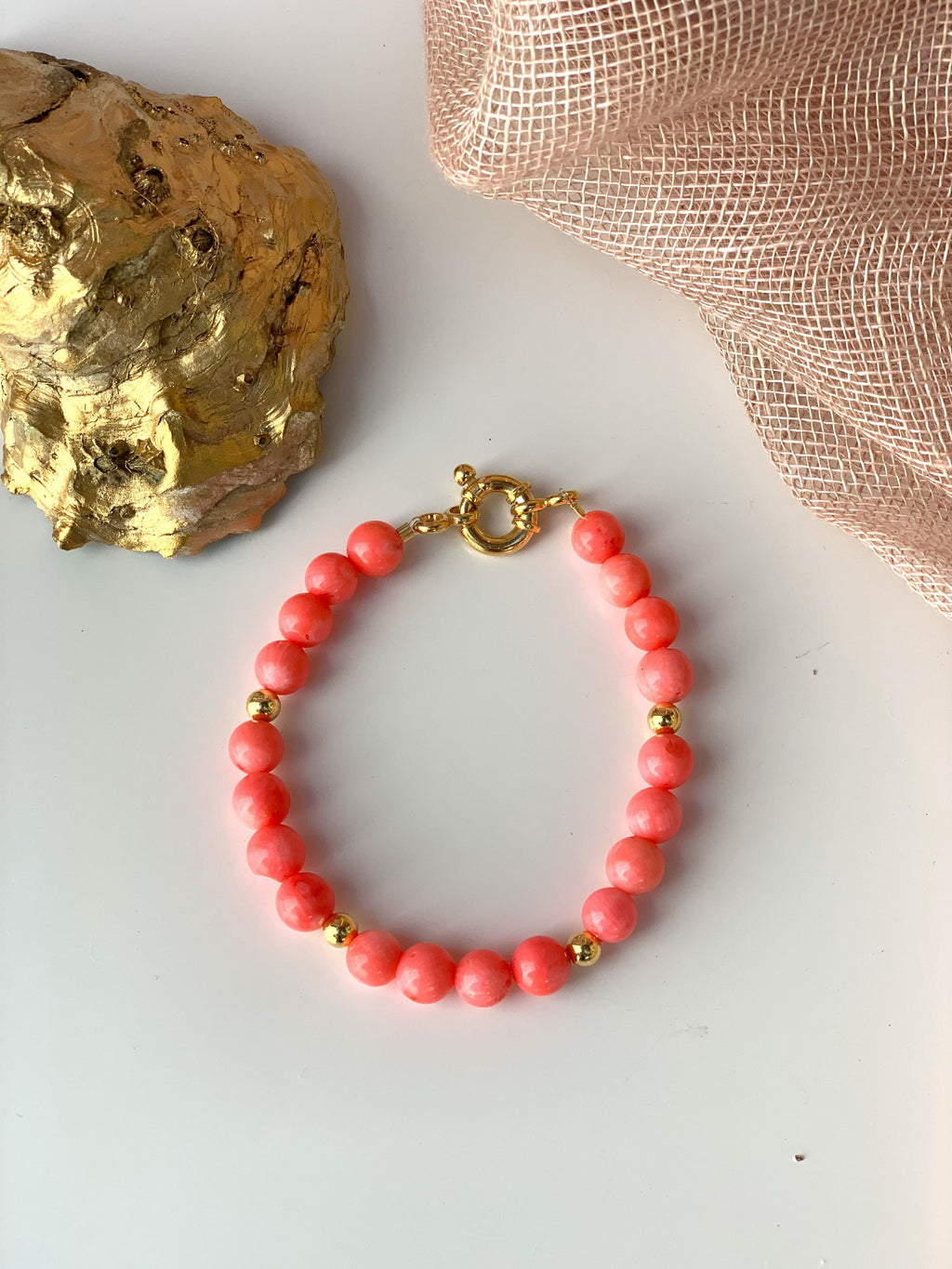Pink coral and gold plated silver bracelet with marine lock