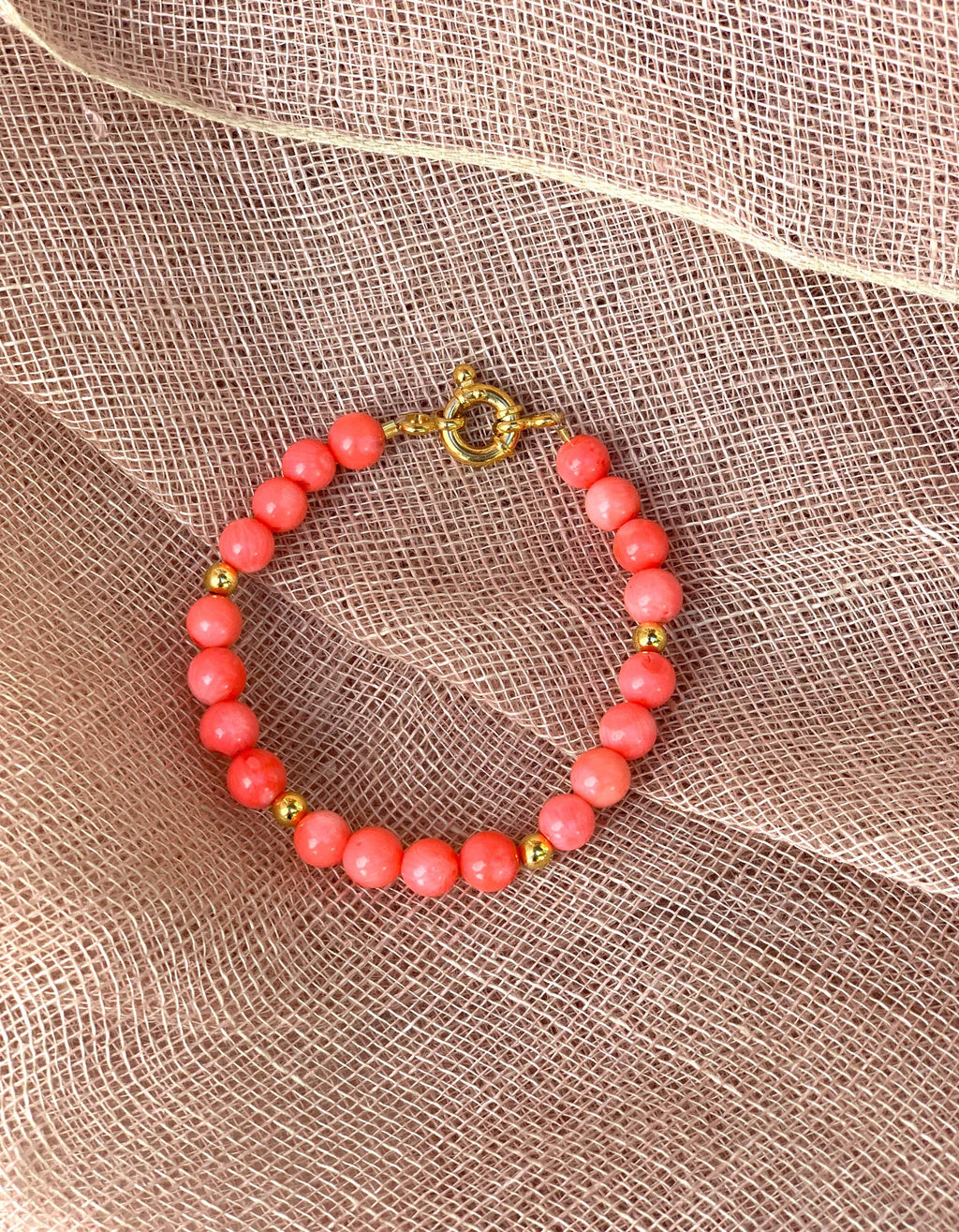 Pink coral and gold plated silver bracelet with marine lock