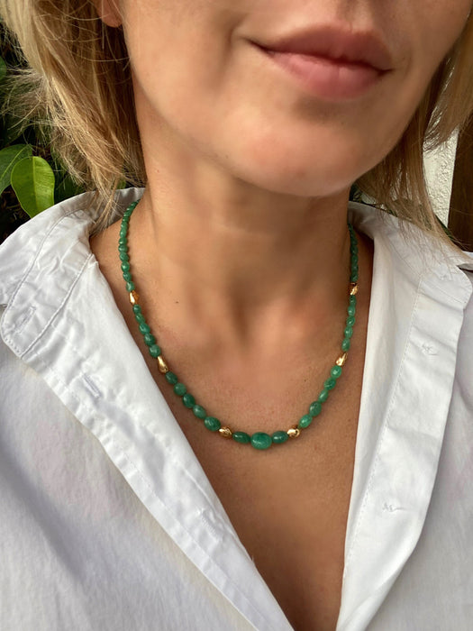 Zambian emerald smooth oval beads necklace with gold vermeil details.