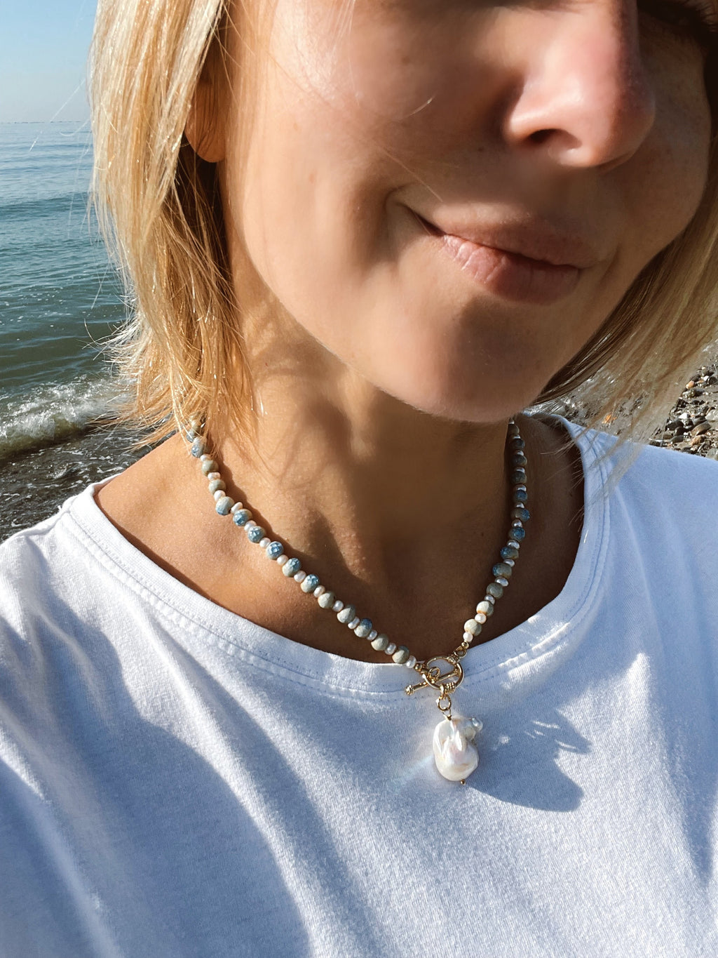 Blue ceramic necklace with baroque pearl pendant