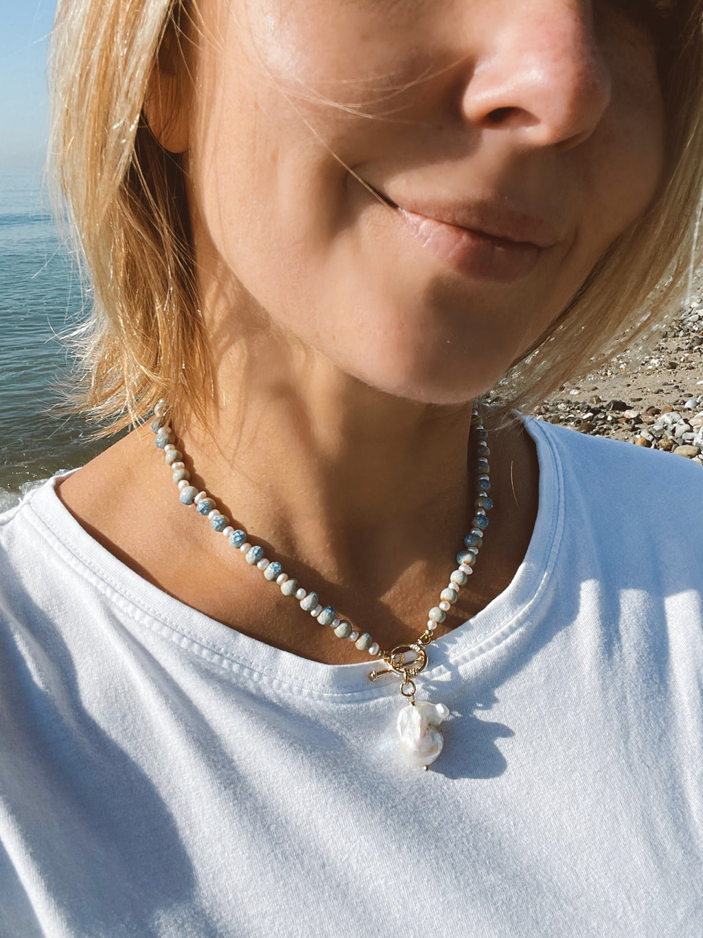 Blue ceramic necklace with baroque pearl pendant