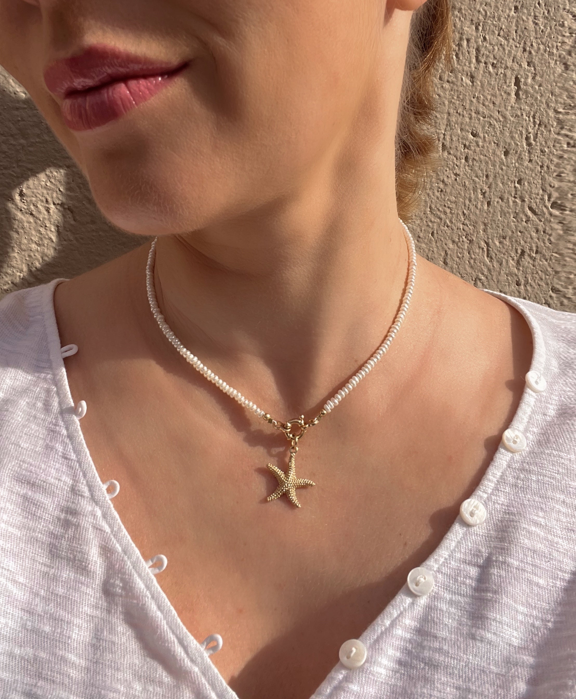 Pearl necklace with golden starfish pendant Beaded Necklaces