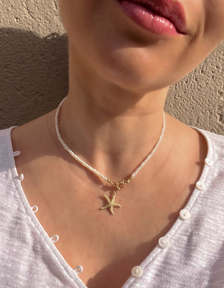 Pearl necklace with golden starfish pendant Beaded Necklaces