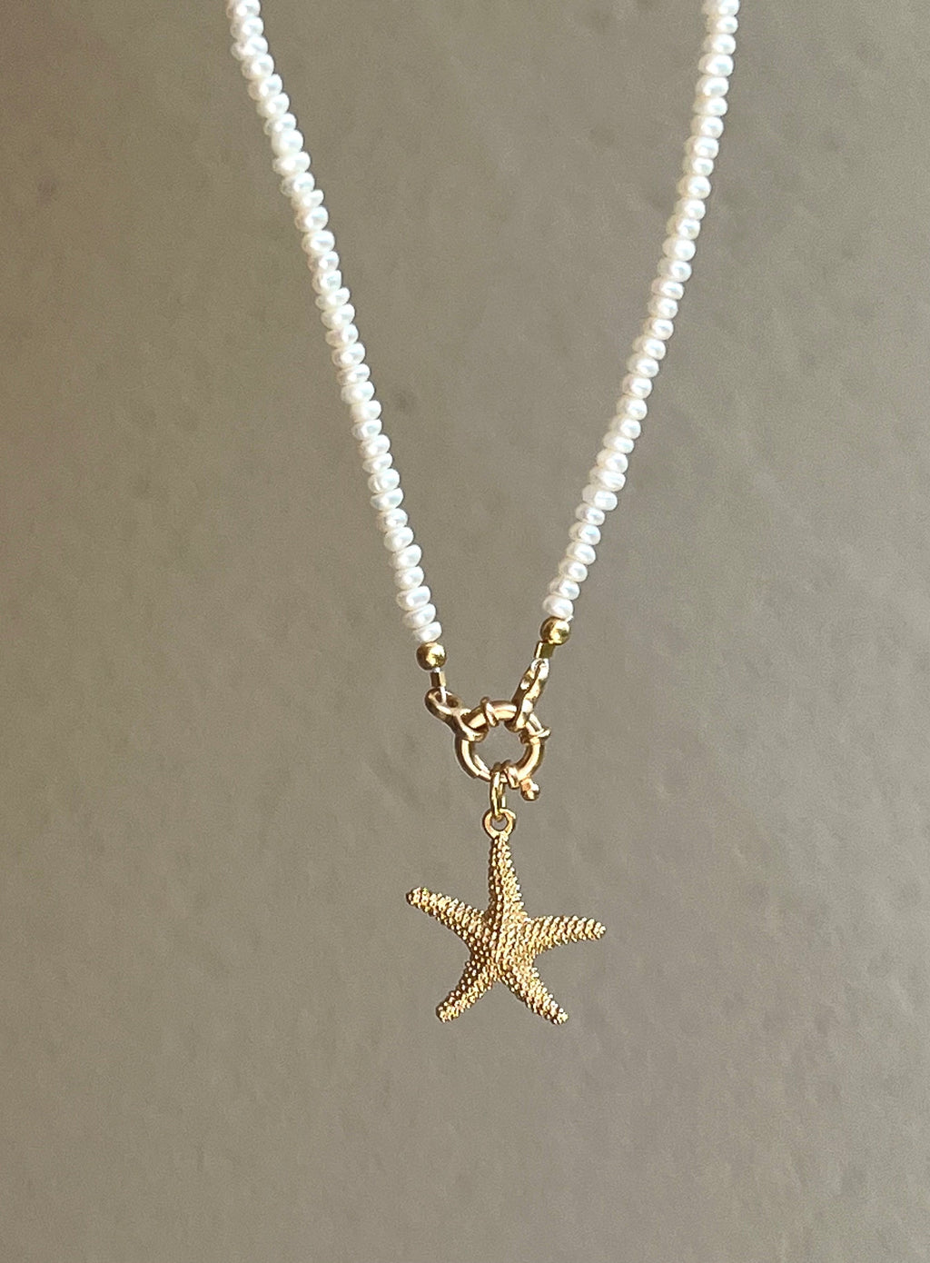 Pearl necklace with golden starfish pendant Beaded Necklaces