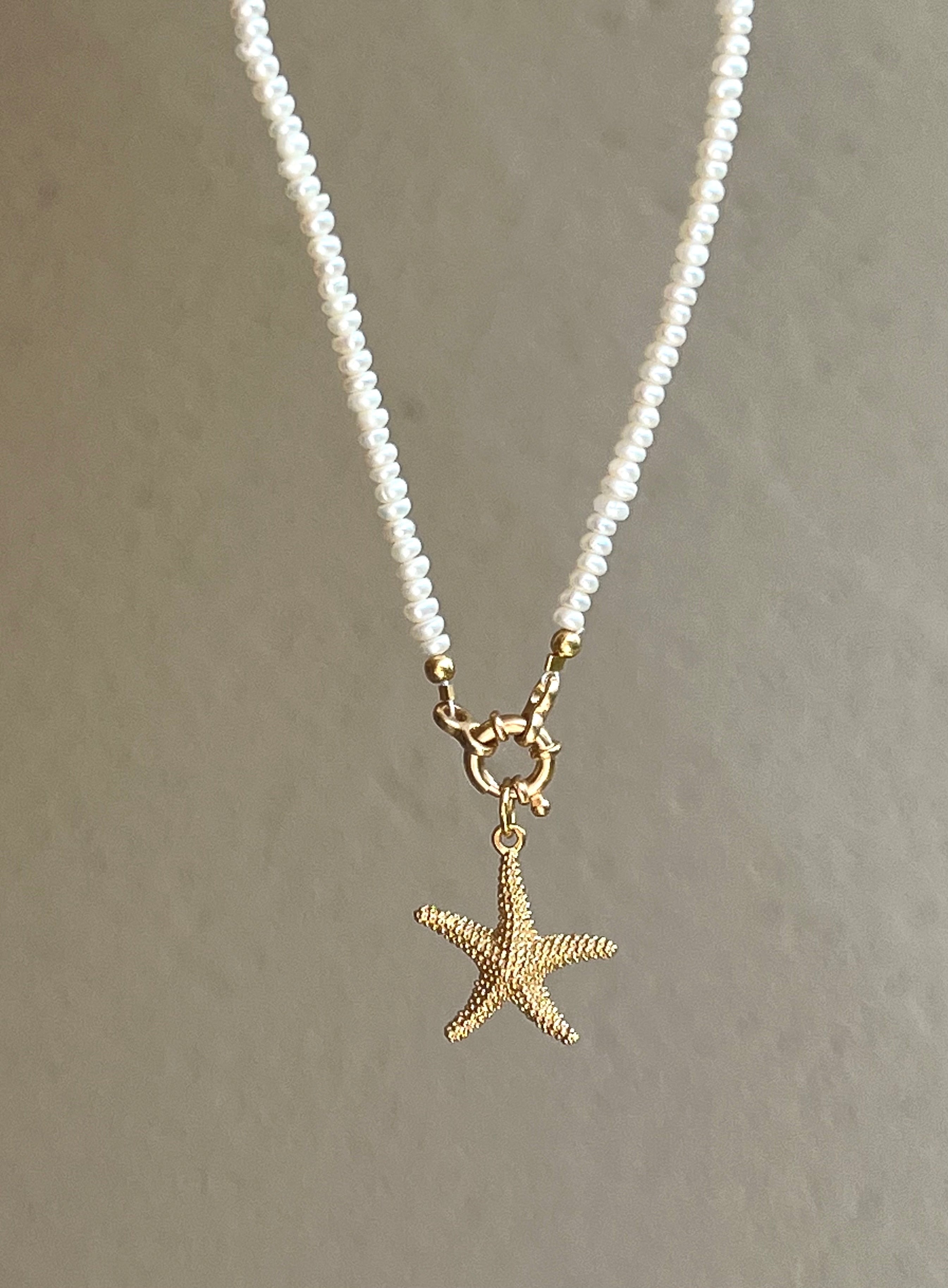 Pearl necklace with golden starfish pendant Beaded Necklaces