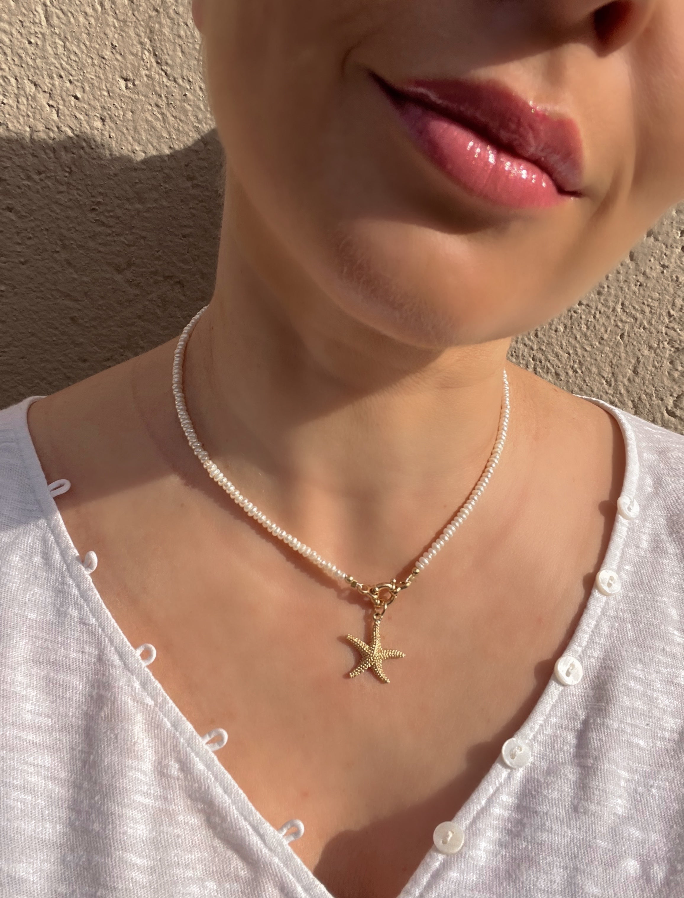 Pearl necklace with golden starfish pendant Beaded Necklaces