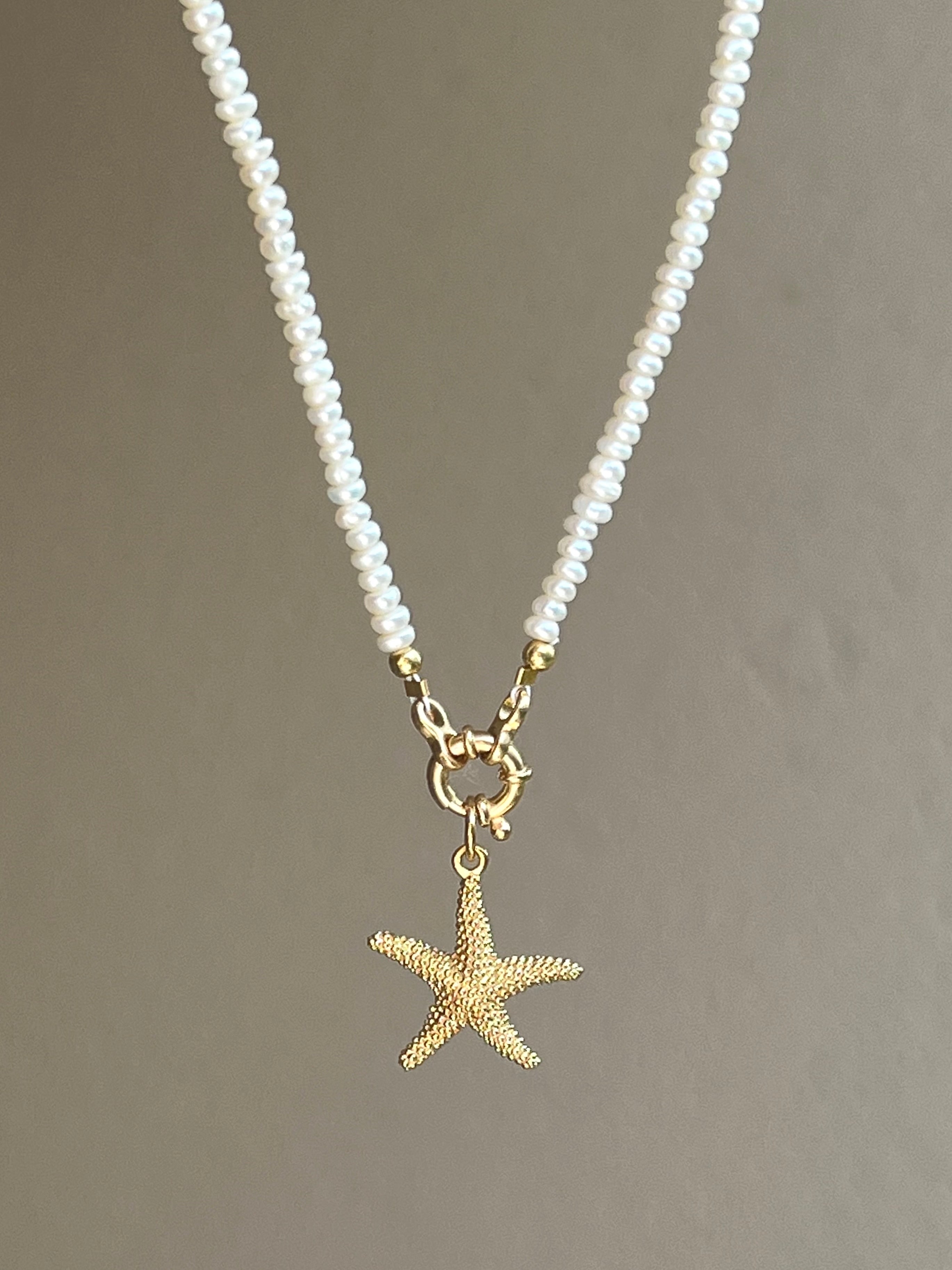 Pearl necklace with golden starfish pendant Beaded Necklaces