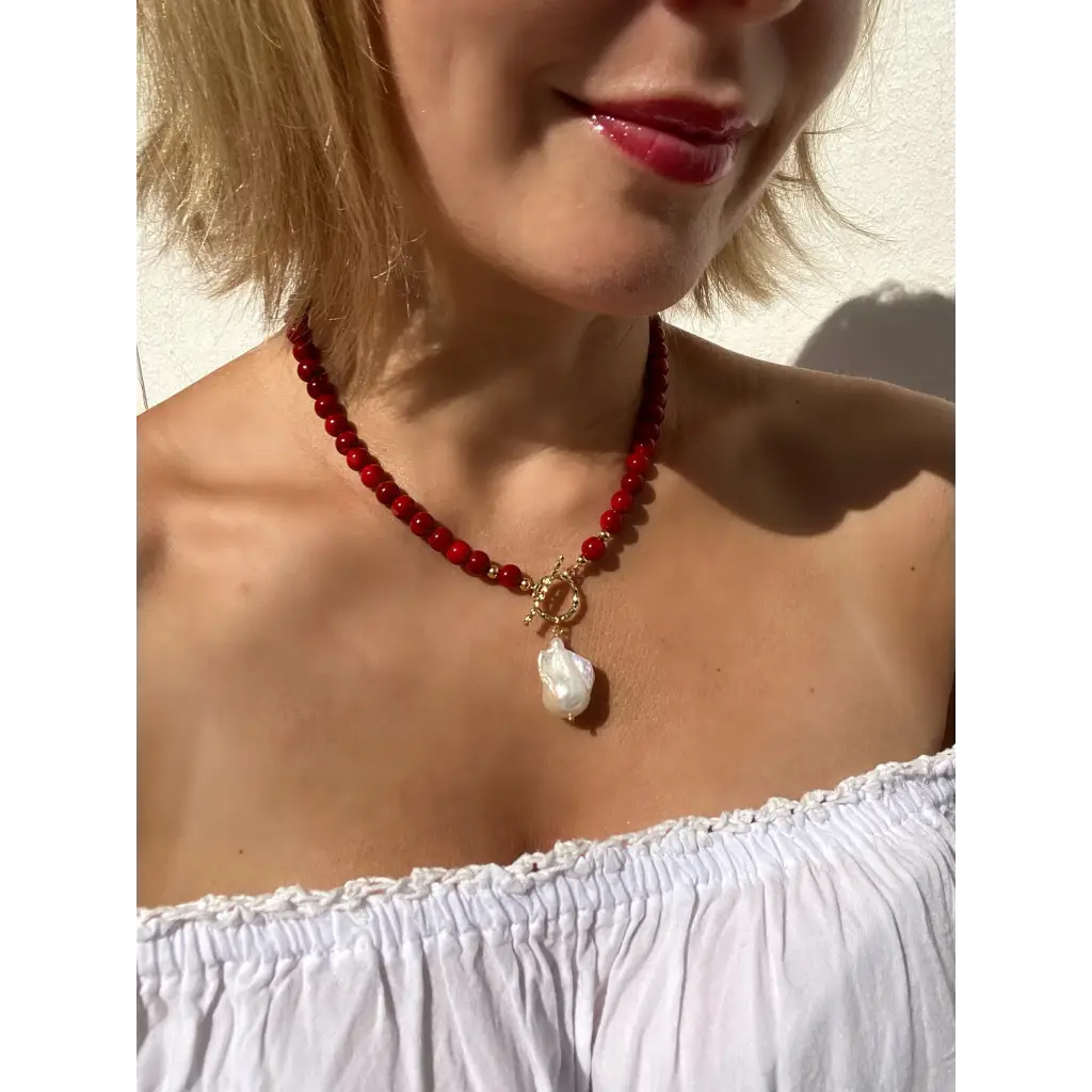 Red coral beaded necklace with toggle closure and baroque