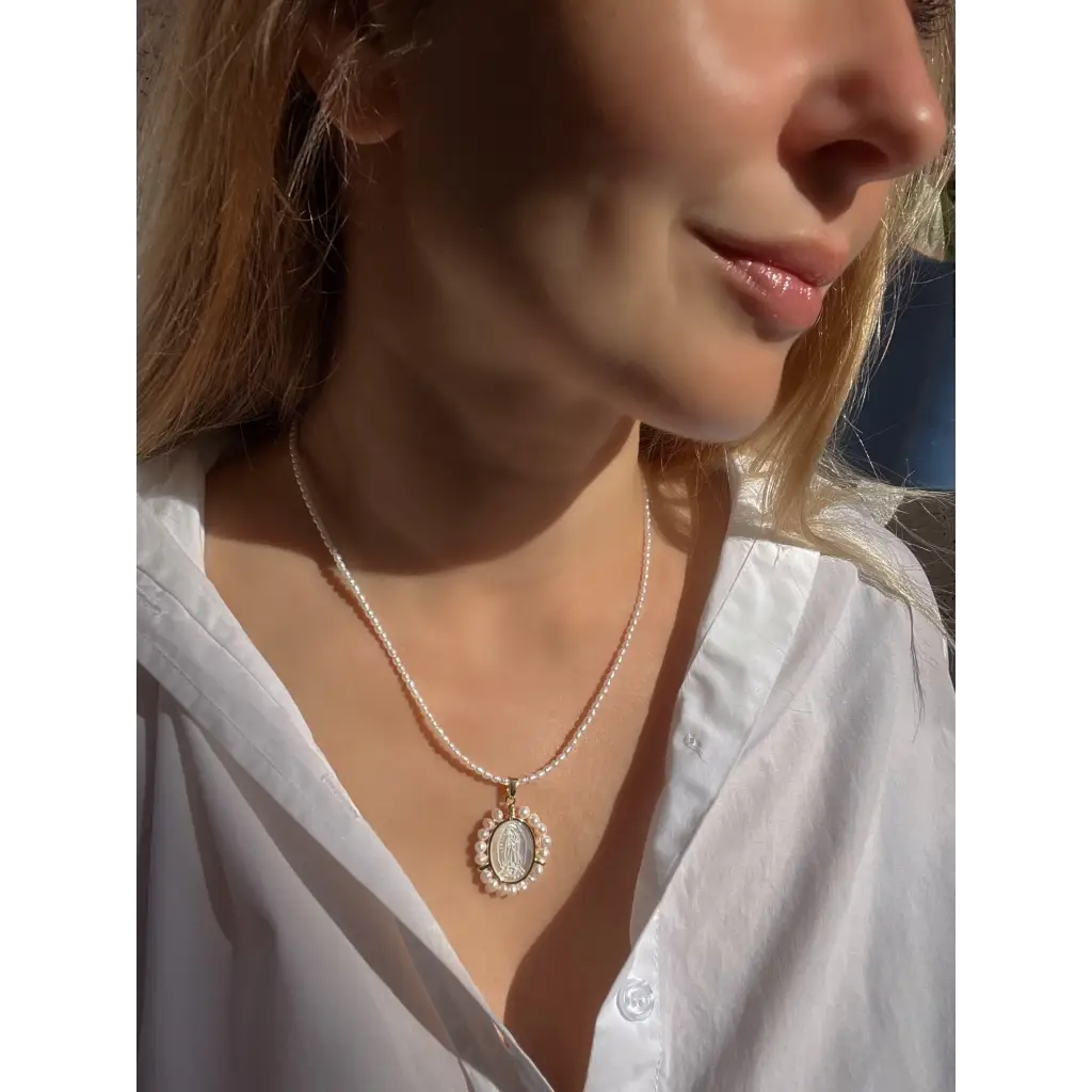 Virgin Mary pendant on pearl chain