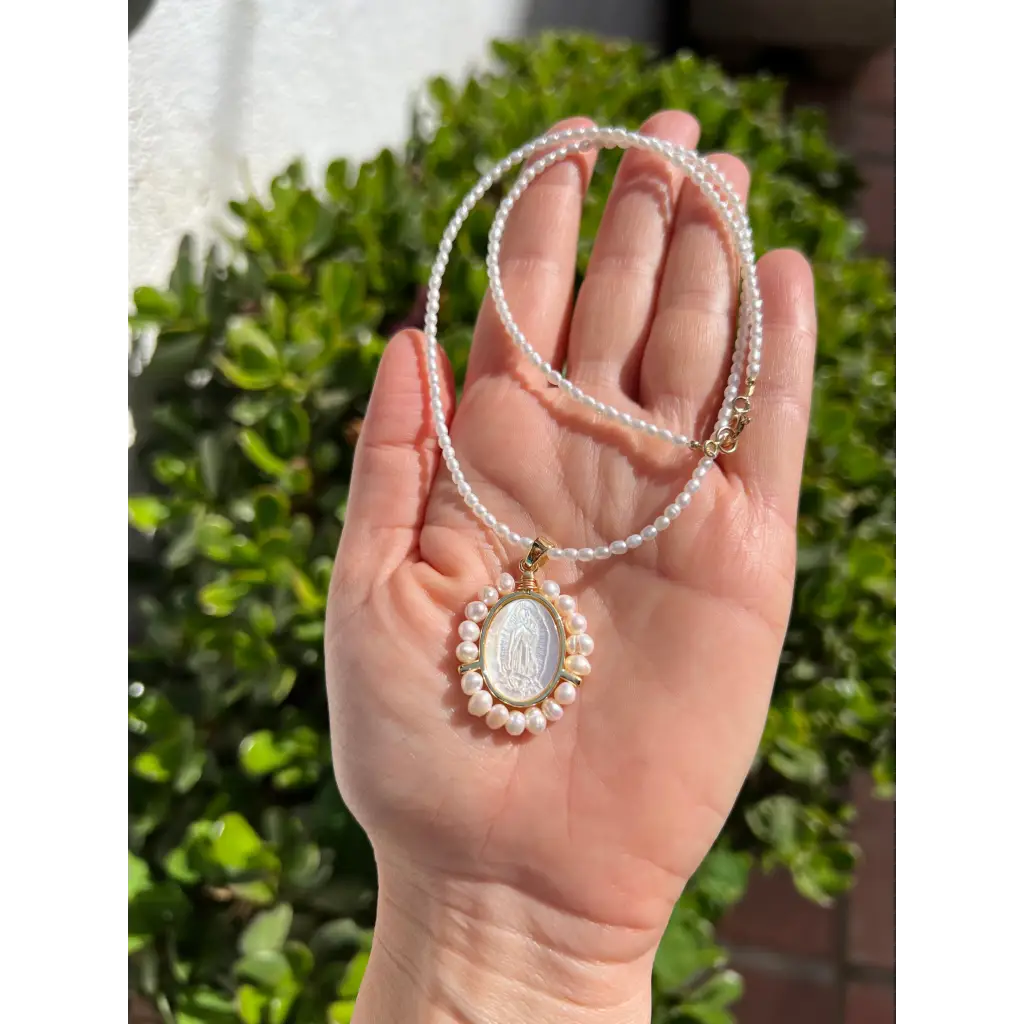 Virgin Mary pendant on pearl chain