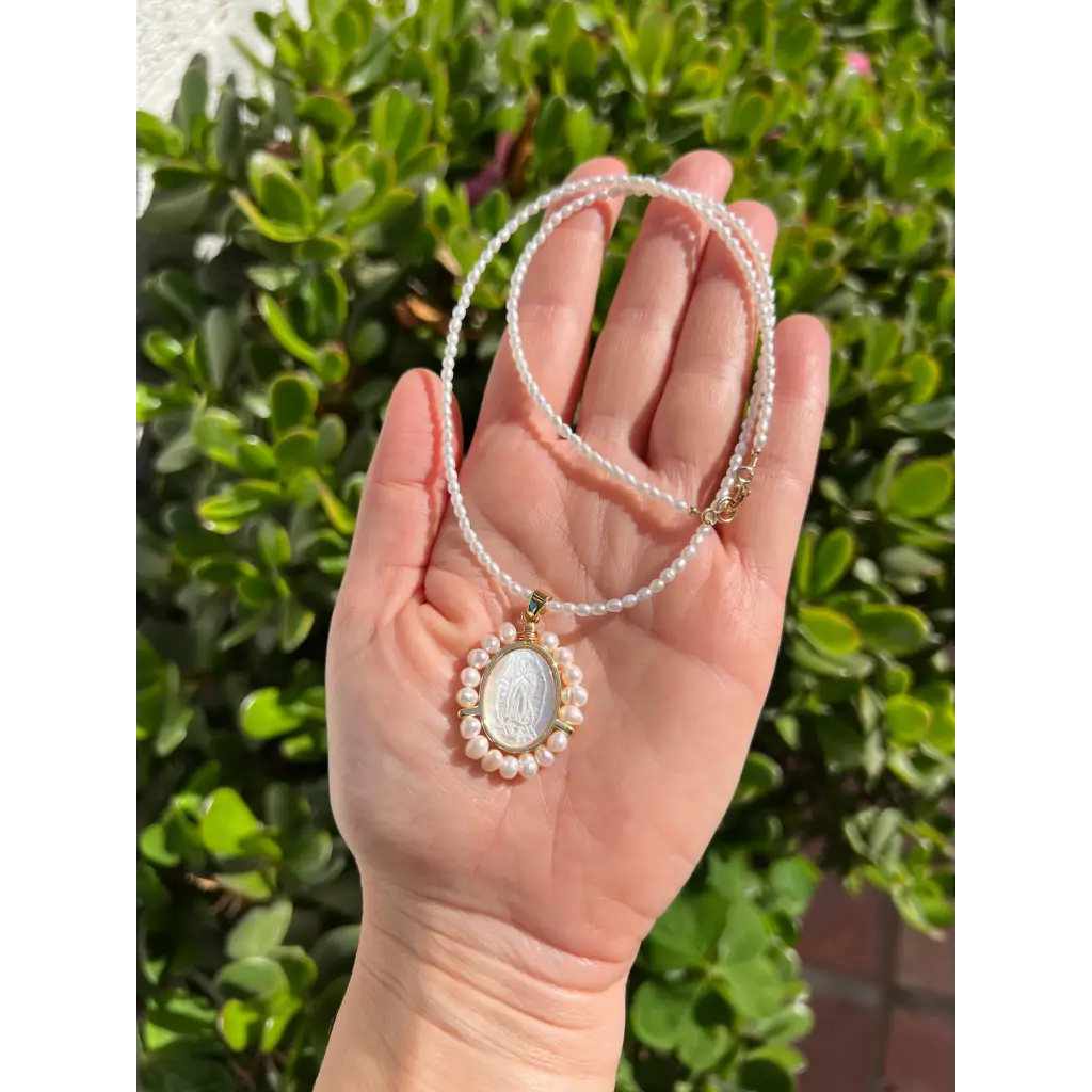 Virgin Mary pendant on pearl chain