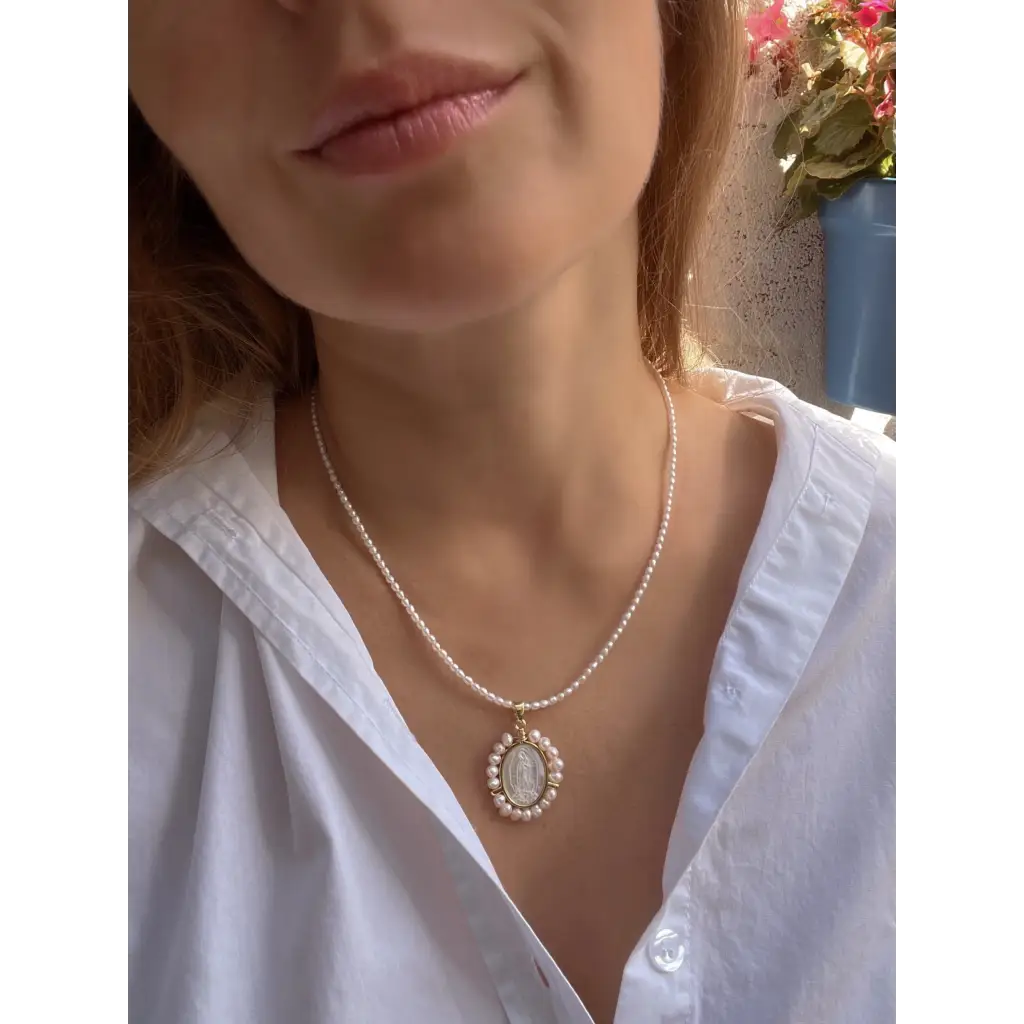 Virgin Mary pendant on pearl chain
