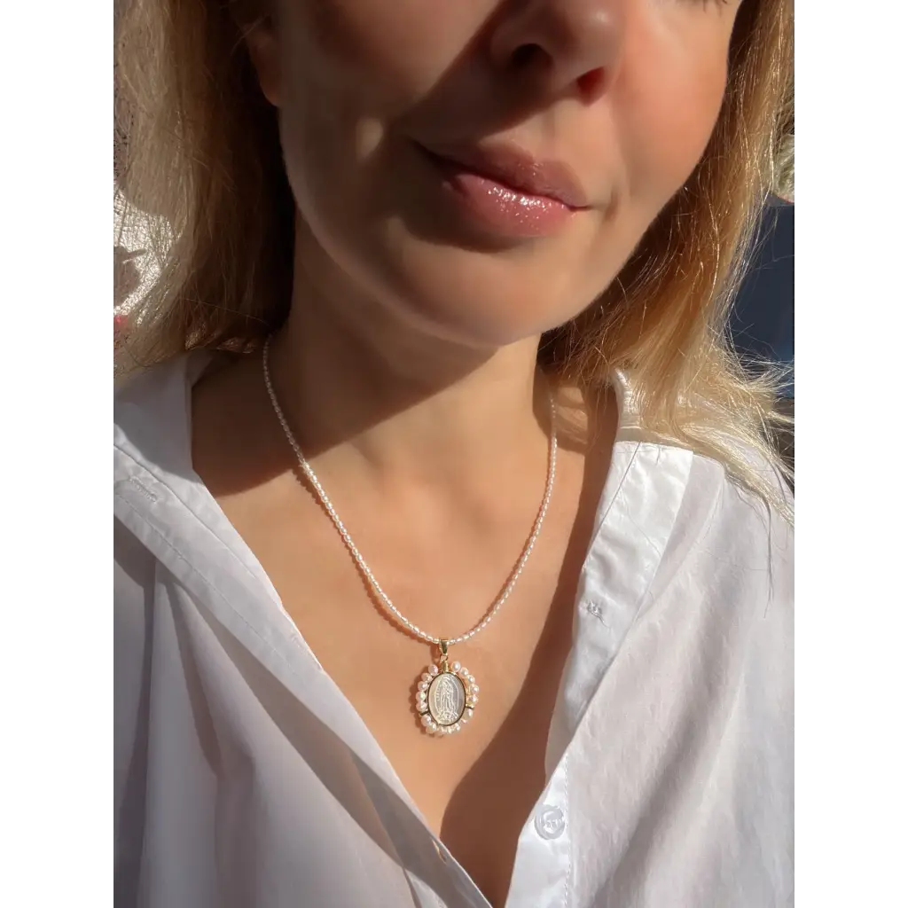 Virgin Mary pendant on pearl chain