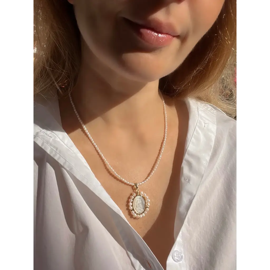 Virgin Mary pendant on pearl chain
