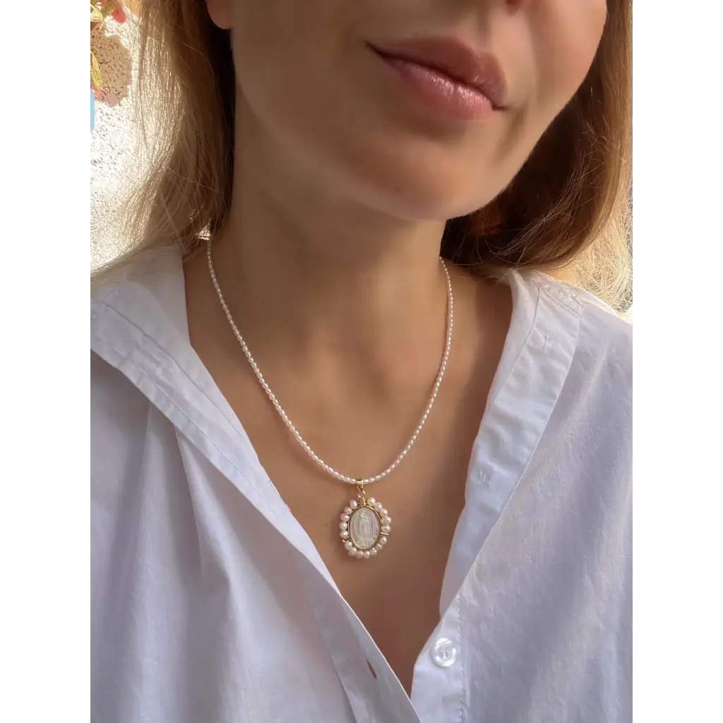 Virgin Mary pendant on pearl chain