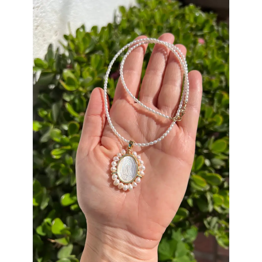 Virgin Mary pendant on pearl chain