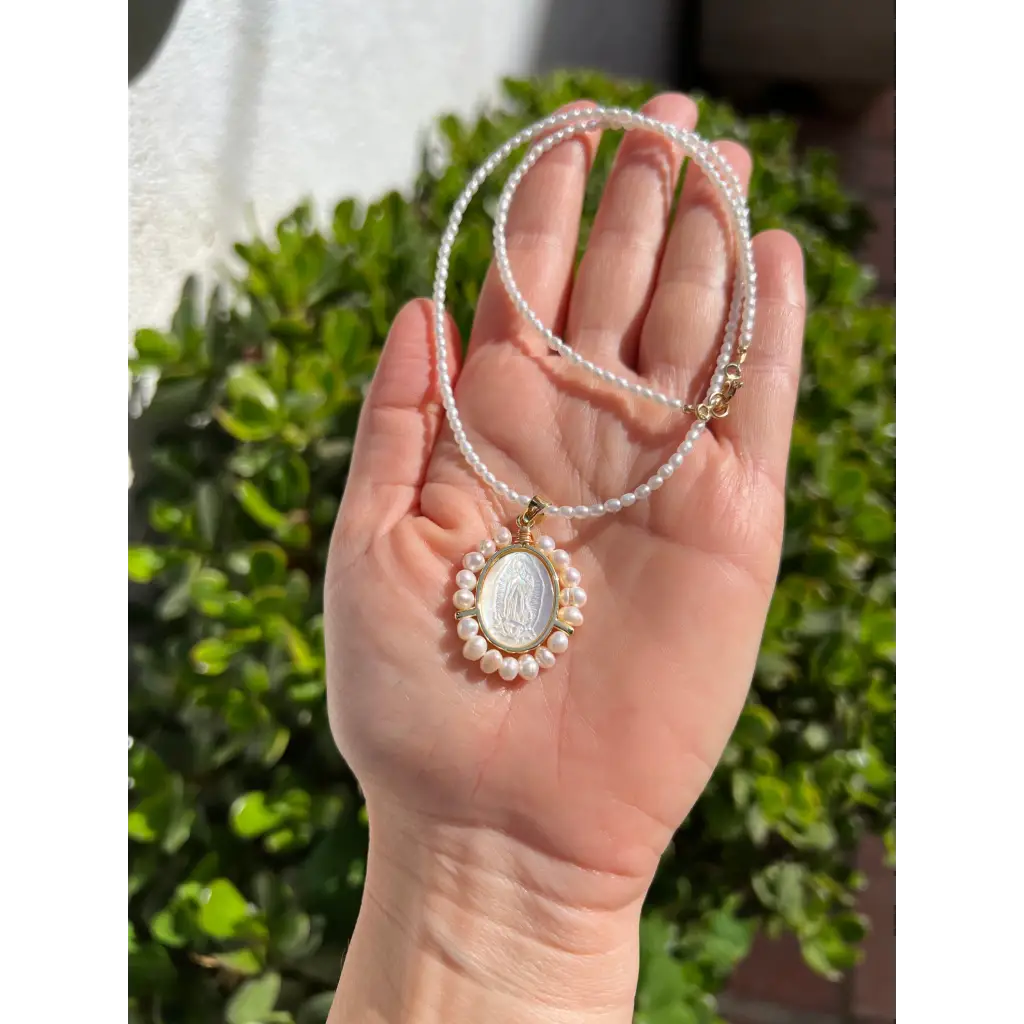 Virgin Mary pendant on pearl chain