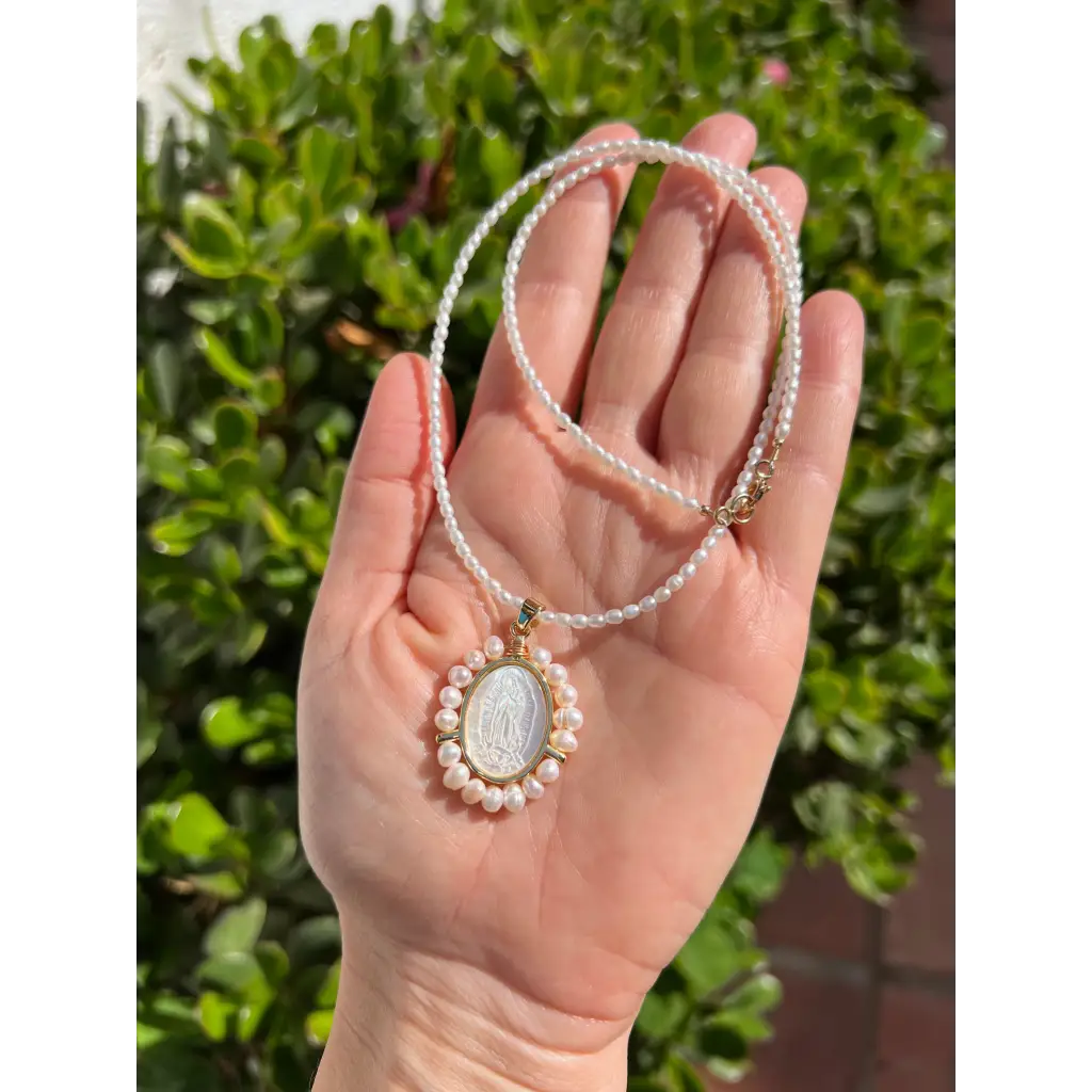 Virgin Mary pendant on pearl chain