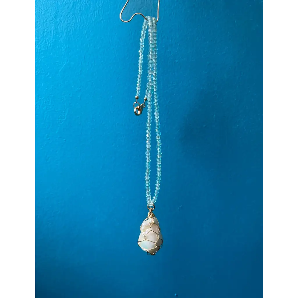 Wire wrapped baroque pearl and sparkling natural blue