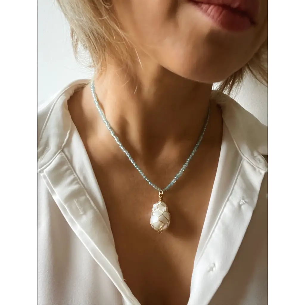 Wire wrapped baroque pearl and sparkling natural blue