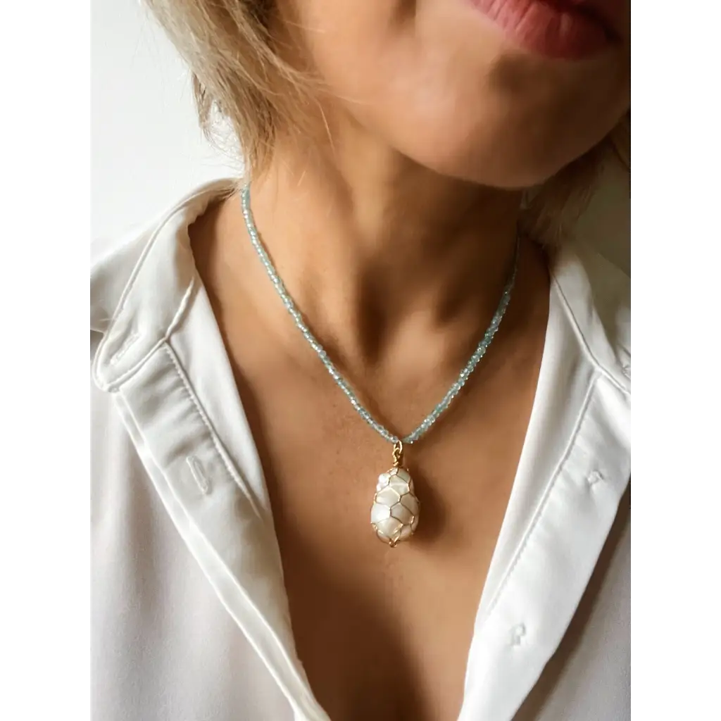 Wire wrapped baroque pearl and sparkling natural blue