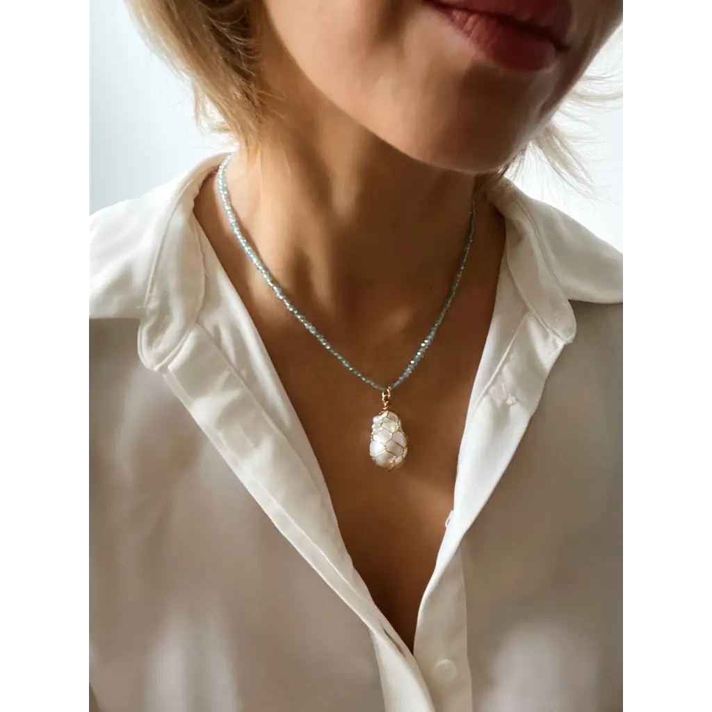 Wire wrapped baroque pearl and sparkling natural blue