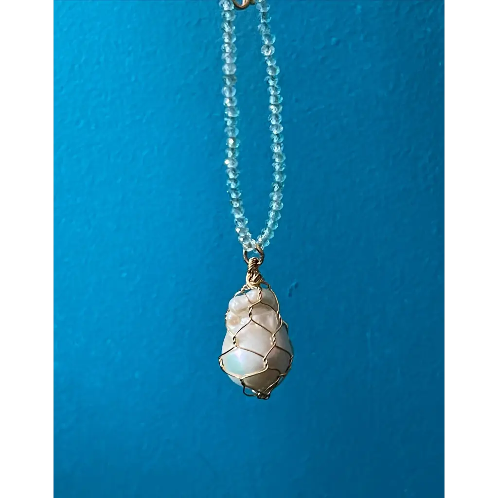 Wire wrapped baroque pearl and sparkling natural blue