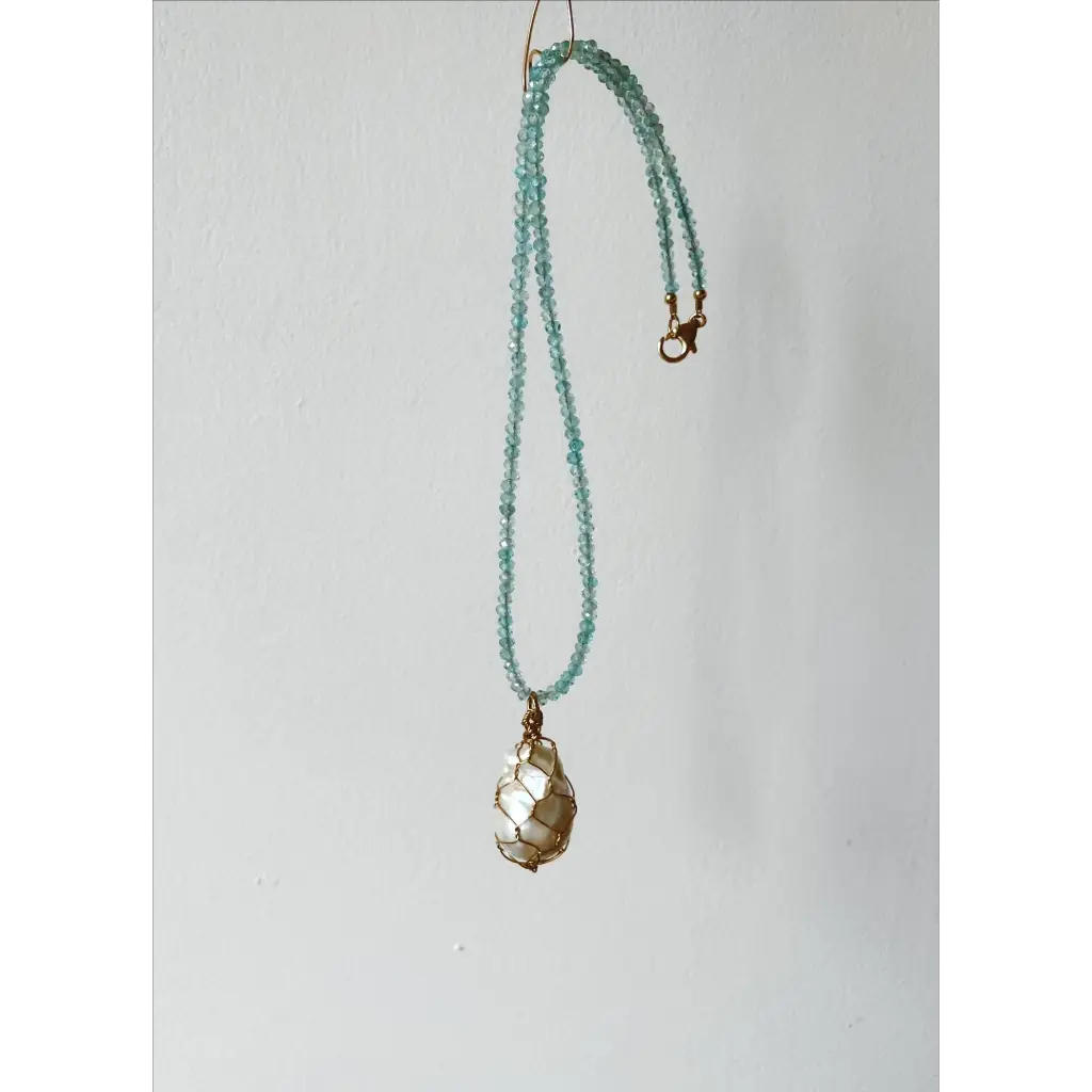Wire wrapped baroque pearl and sparkling natural blue