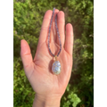 Wire wrapped baroque pearl pendant on iolite beaded necklace